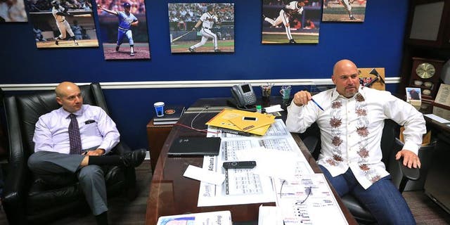 Atlanta Braves manager Fredi Gonzalez, right, and general manager John Coppolella hold end of season interviews Monday, Oct. 5, 2015, in Atlanta. Atlanta finished the season with 67 wins, under 70 wins in a full season for the first time since 1990. (Curtis Compton /Atlanta Journal-Constitution via AP) MARIETTA DAILY OUT; GWINNETT DAILY POST OUT; LOCAL TELEVISION OUT; WXIA-TV OUT; WGCL-TV OUT; MANDATORY CREDIT