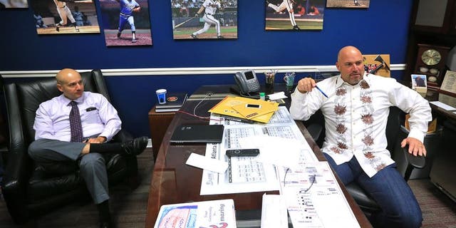 Atlanta Braves manager Fredi Gonzalez, right, and general manager John Coppolella hold end of season interviews Monday, Oct. 5, 2015, in Atlanta. Atlanta finished the season with 67 wins, under 70 wins in a full season for the first time since 1990. (Curtis Compton /Atlanta Journal-Constitution via AP) MARIETTA DAILY OUT; GWINNETT DAILY POST OUT; LOCAL TELEVISION OUT; WXIA-TV OUT; WGCL-TV OUT; MANDATORY CREDIT