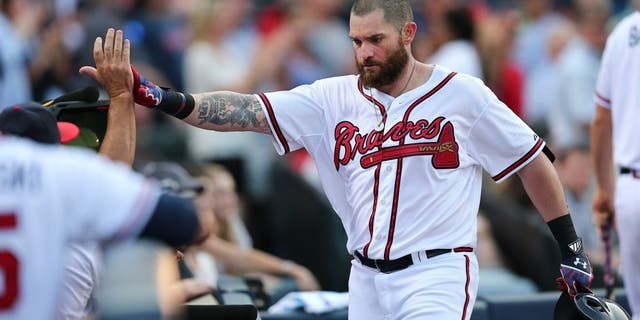 Atlanta Braves' Jonny Gomes celebrates after hitting a two-run home run in the first inning of a baseball game against the Colorado Rockies Monday, Aug. 24, 2015, in Atlanta. Atlanta won 5-3. (AP Photo/John Bazemore)