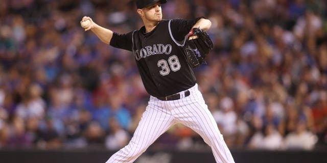 Sep 26, 2015; Denver, CO, USA; Colorado Rockies starting pitcher Kyle Kendrick (38) delivers a pitch during the fourth inning against the Los Angeles Dodgers at Coors Field. The Rockies won 8-6. Mandatory Credit: Chris Humphreys-USA TODAY Sports