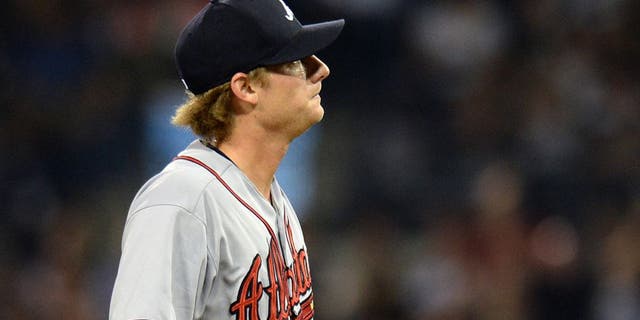 Aug 18, 2015; San Diego, CA, USA; Atlanta Braves relief pitcher Ross Detwiler (56) reacts during the sixth inning against the San Diego Padres at Petco Park. Mandatory Credit: Jake Roth-USA TODAY Sports