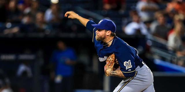 Sep 23, 2013; Atlanta, GA, USA; Milwaukee Brewers relief pitcher Michael Blazek (54) pitches in the ninth inning against the Atlanta Braves at Turner Field. The Brewers won 5-0. Mandatory Credit: Daniel Shirey-USA TODAY Sports