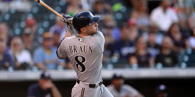 Jun 19, 2015; Denver, CO, USA; Milwaukee Brewers right fielder Ryan Braun hits a two run home run in the fist inning against against the Colorado Rockies at Coors Field.