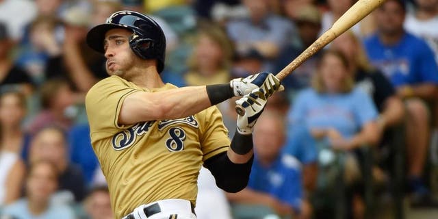 Milwaukee Brewers right fielder Ryan Braun hits a double in the third inning against the Chicago Cubs at Miller Park on Sunday, Aug. 2, 2015.