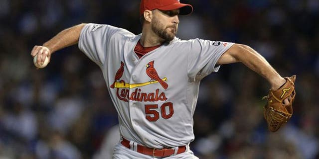 CORRECTS TO RELIEF PITCHER FROM STARTING PITCHER - St. Louis Cardinals relief pitcher Adam Wainwright (50) throws during the seventh inning of Game 3 in baseball's National League Division Series, Monday, Oct. 12, 2015, in Chicago. (AP Photo/Paul Beaty)