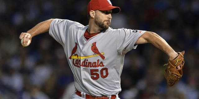CORRECTS TO RELIEF PITCHER FROM STARTING PITCHER - St. Louis Cardinals relief pitcher Adam Wainwright (50) throws during the seventh inning of Game 3 in baseball's National League Division Series, Monday, Oct. 12, 2015, in Chicago. (AP Photo/Paul Beaty)