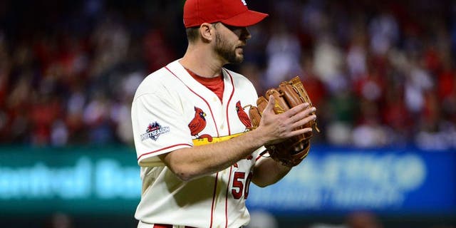 Oct 10, 2015; St. Louis, MO, USA; St. Louis Cardinals pitcher Adam Wainwright (50) reacts after ending the seventh inning in game two of the NLDS against the Chicago Cubs at Busch Stadium. Mandatory Credit: Jeff Curry-USA TODAY Sports