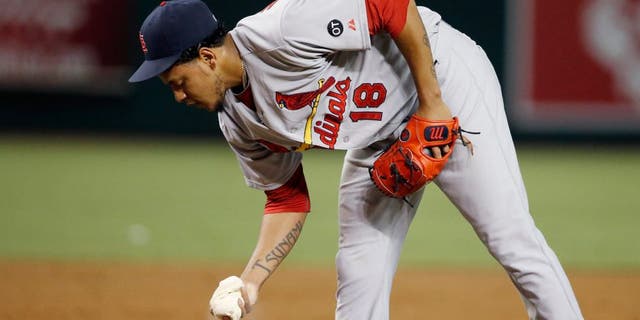St. Louis Cardinals' Carlos Martinez grabs the rosin bag after giving up a two-run single to Arizona Diamondbacks' Ender Inciarte during the second inning of a baseball game Wednesday, Aug. 27, 2015, in Phoenix. (AP Photo/Ross D. Franklin)