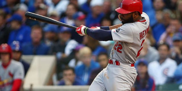 October 13, 2015; Chicago, IL, USA; St. Louis Cardinals right fielder Jason Heyward (22) hits a single in the sixth inning against Chicago Cubs in game four of the NLDS at Wrigley Field. Mandatory Credit: Jerry Lai-USA TODAY Sports