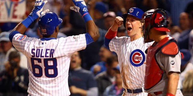 Oct 12, 2015; Chicago, IL, USA; Chicago Cubs right fielder Jorge Soler (68) celebrates with left fielder Chris Coghlan (8) after hitting a two run home run during the sixth inning against the St. Louis Cardinals in game three of the NLDS at Wrigley Field. Mandatory Credit: Jerry Lai-USA TODAY Sports