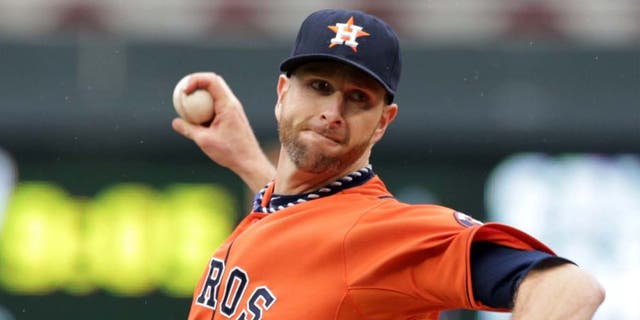 Saturday, June 7: Houston Astros pitcher Scott Feldman throws against the Minnesota Twins in the first inning.