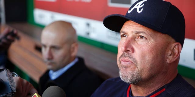 FILE - In this April 13, 2016, file photo, Atlanta Braves manager Fredi Gonzalez, right, with general manager John Coppolella sitting at left, talks with the media before a baseball game against the Washington Nationals at Nationals Park, in Washington. The Atlanta Braves have fired manager Fredi Gonzalez, who couldnât survive the worst record in the majors. Braves general manager John Coppolella confirmed the firing of Gonzalez, in his sixth season, Tuesday, May 17, 2016. (AP Photo/Alex Brandon, File)