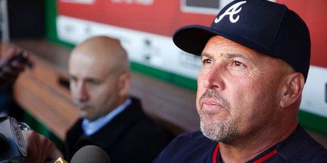 FILE - In this April 13, 2016, file photo, Atlanta Braves manager Fredi Gonzalez, right, with general manager John Coppolella sitting at left, talks with the media before a baseball game against the Washington Nationals at Nationals Park, in Washington. The Atlanta Braves have fired manager Fredi Gonzalez, who couldnât survive the worst record in the majors. Braves general manager John Coppolella confirmed the firing of Gonzalez, in his sixth season, Tuesday, May 17, 2016. (AP Photo/Alex Brandon, File)