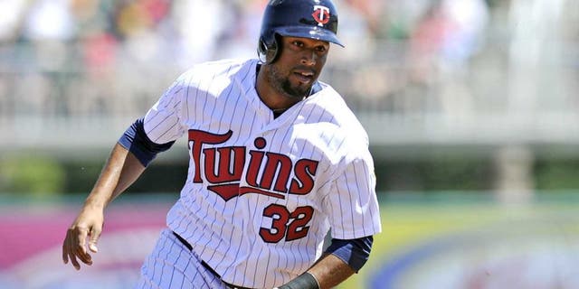 March 13, 2014: Minnesota Twins center fielder Aaron Hicks rounds third base during a game against the Boston Red Sox at Hammond Stadium.