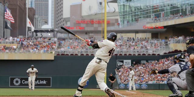The Minnesota Twins' Torii Hunter hits a three-run home run off New York Yankees starting pitcher CC Sabathia during the third inning in Minneapolis, Saturday, July 25, 2015.