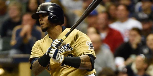Milwaukee Brewers catcher Martin Maldonado hits a single in the sixth inning against the Chicago Cubs at Miller Park on Saturday, Oct. 3, 2015.