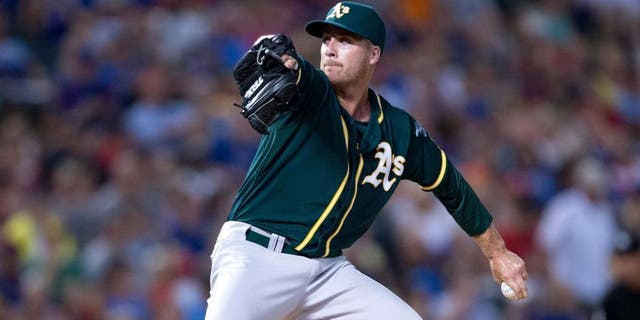 Jul 25, 2014; Arlington, TX, USA; Oakland Athletics relief pitcher Eric O'Flaherty (39) pitches during the game against the Texas Rangers at Globe Life Park in Arlington. The Rangers defeated the Athletics 4-1. Mandatory Credit: Jerome Miron-USA TODAY Sports