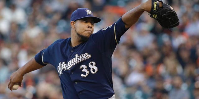 Milwaukee Brewers pitcher Wily Peralta throws against the San Francisco Giants during the first inning in San Francisco, Tuesday, July 28, 2015.