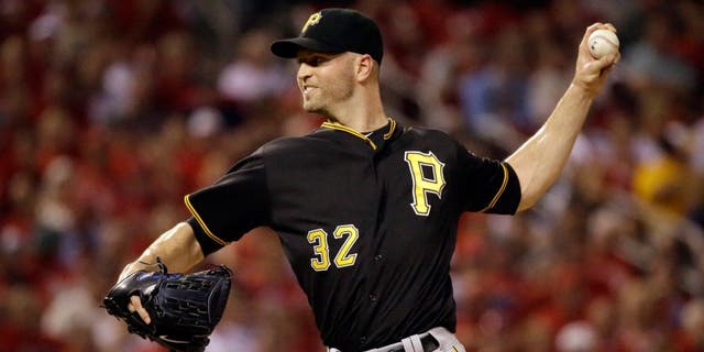 Pittsburgh Pirates starting pitcher J.A. Happ throws during the first inning of a baseball game against the St. Louis Cardinals on Friday, Sept. 4, 2015, in St. Louis. (AP Photo/Jeff Roberson)