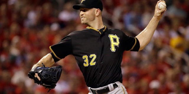 Pittsburgh Pirates starting pitcher J.A. Happ throws during the first inning of a baseball game against the St. Louis Cardinals on Friday, Sept. 4, 2015, in St. Louis. (AP Photo/Jeff Roberson)