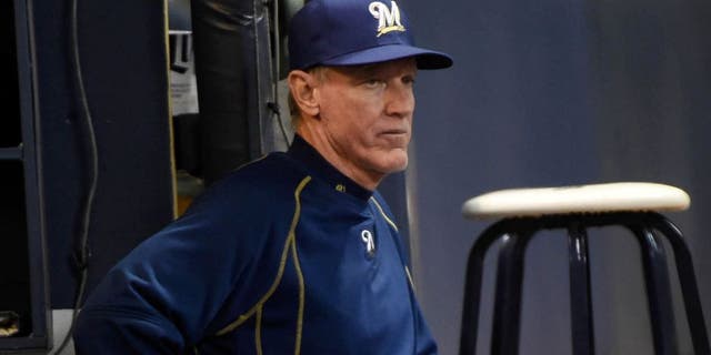 Apr 20, 2015; Milwaukee, WI, USA; Milwaukee Brewers manager Ron Roenicke watches the game against the Cincinnati Reds in the sixth inning at Miller Park.