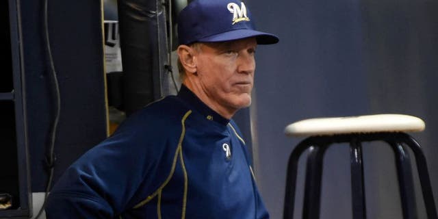 Apr 20, 2015; Milwaukee, WI, USA; Milwaukee Brewers manager Ron Roenicke watches the game against the Cincinnati Reds in the sixth inning at Miller Park.