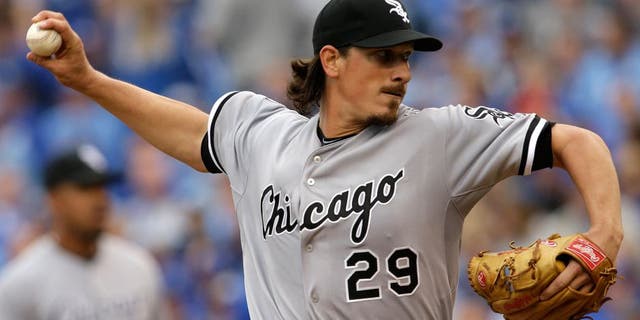 Chicago White Sox starting pitcher Jeff Samardzija (29) delivers to a Kansas City Royals batter during the first inning an opening day baseball game at Kauffman Stadium in Kansas City, Mo., Monday, April 6, 2015. (AP Photo/Orlin Wagner)