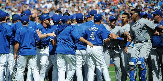 Aug 2, 2015; Toronto, Ontario, CAN; Toronto Blue Jays and Kansas City Royals players confrontation after relief pitcher Aaron Sanchez (41) pitches and hits Kansas City Royals short stop Alcides Escobar (2) (not in picture) and gets ejected by home plate umpire Jim Wolf in the eighth inning at Rogers Centre. Blue Jays beat Royals 5 - 2. Mandatory Credit: Peter Llewellyn-USA TODAY Sports
