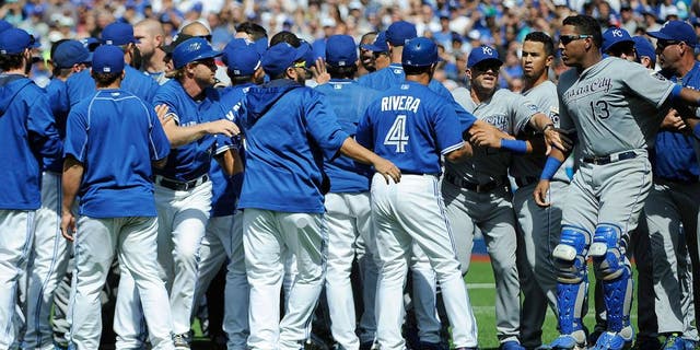 Aug 2, 2015; Toronto, Ontario, CAN; Toronto Blue Jays and Kansas City Royals players confrontation after relief pitcher Aaron Sanchez (41) pitches and hits Kansas City Royals short stop Alcides Escobar (2) (not in picture) and gets ejected by home plate umpire Jim Wolf in the eighth inning at Rogers Centre. Blue Jays beat Royals 5 - 2. Mandatory Credit: Peter Llewellyn-USA TODAY Sports
