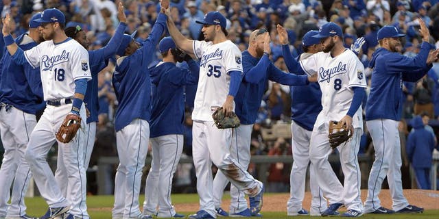 Oct 17, 2015; Kansas City, MO, USA; Kansas City Royals first baseman Eric Hosmer (35) celebrates with teammate after beating the Toronto Blue Jays in game two of the ALCS at Kauffman Stadium. Mandatory Credit: Denny Medley-USA TODAY Sports