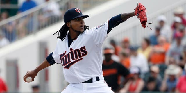 The Minnesota Twins' Ervin Santana works against the Baltimore Orioles in the first inning of a spring training game in Fort Myers, Fla., Sunday, March 8, 2015.