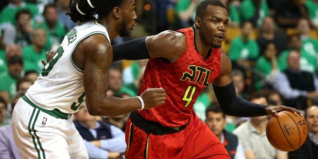 Apr 28, 2016; Boston, MA, USA; Atlanta Hawks forward Paul Millsap (4) drives to the hoop against Boston Celtics forward Jae Crowder (left) during the second half in game six of the first round of the NBA Playoffs at TD Garden. Mandatory Credit: Mark L. Baer-USA TODAY Sports