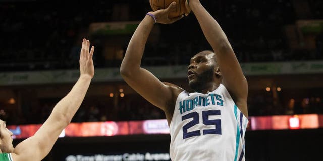 Mar 30, 2015; Charlotte, NC, USA; Charlotte Hornets center Al Jefferson (25) shoots the ball over Boston Celtics center Tyler Zeller (44) during the first half at Time Warner Cable Arena. Mandatory Credit: Jeremy Brevard-USA TODAY Sports