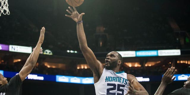 Jan 19, 2015; Charlotte, NC, USA; Charlotte Hornets center Al Jefferson (25) shoots the ball during the second half against the Minnesota Timberwolves at Time Warner Cable Arena. The Hornets won 105-80. Mandatory Credit: Jeremy Brevard-USA TODAY Sports