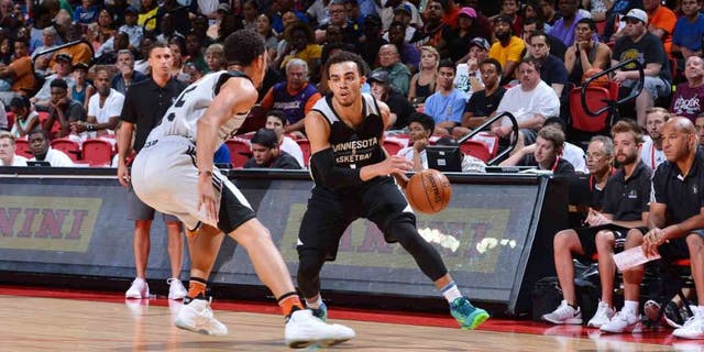 The Minnesota Timberwolves' Tyus Jones handles the ball against the Phoenix Suns during a 2016 NBA Las Vegas Summer League tournament semifinal game July 17, 2016, at the Thomas & Mack Center in Las Vegas.