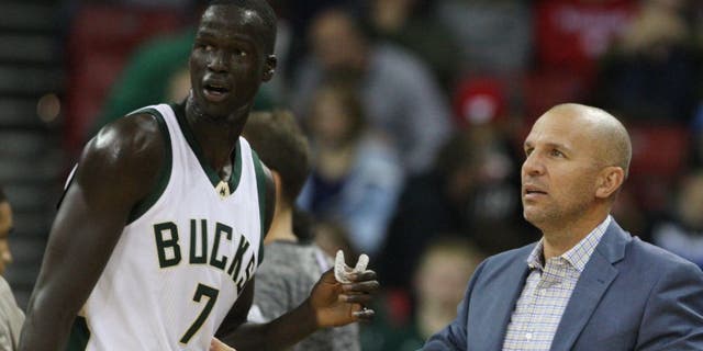 Milwaukee Bucks head coach Jason Kidd talks with Milwaukee Bucks forward Thon Maker during the game with the Dallas Mavericks.