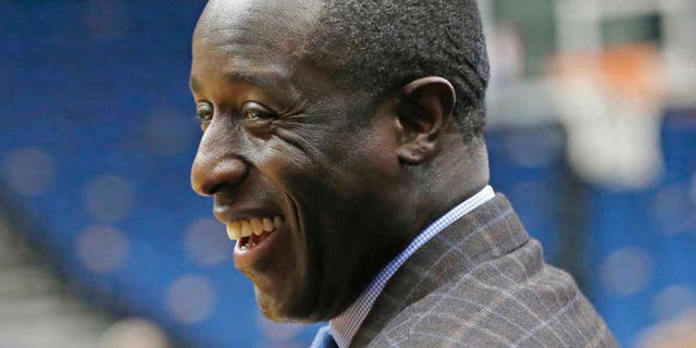 Minnesota Timberwolves general manager Milt Newton smiles prior to the Timberwolves' game against the Hawks in Minneapolis on Wednesday, Nov. 25, 2015. Newton has risen up the ranks to become one of five African-Americans with final decision-making power in the NBA and is wrestling with the excitement for his opportunity and the grief for how it came about after the death of coach Flip Saunders.