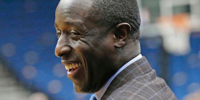 Minnesota Timberwolves general manager Milt Newton smiles prior to the Timberwolves' game against the Hawks in Minneapolis on Wednesday, Nov. 25, 2015. Newton has risen up the ranks to become one of five African-Americans with final decision-making power in the NBA and is wrestling with the excitement for his opportunity and the grief for how it came about after the death of coach Flip Saunders.