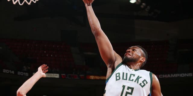 Jabari Parker of the Milwaukee Bucks goes up for a lay up during a preseason game against the Dallas Mavericks.