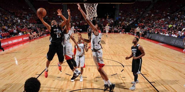The Minnesota Timberwolves' Xavier Silas shoots the ball against the Toronto Raptors during the 2016 Las Vegas Summer League on July 16, 2016, at the Thomas & Mack Center in Las Vegas.
