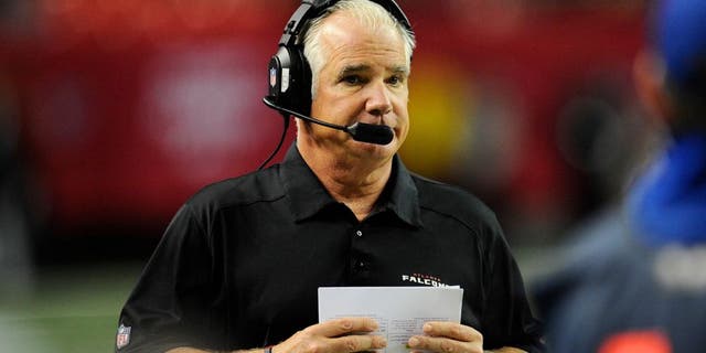 Dec 15, 2013; Atlanta, GA, USA; Atlanta Falcons head coach Mike Smith shown on the sideline against the Washington Redskins during the second half at the Georgia Dome. The Falcons defeated the Redskins 27-26. Mandatory Credit: Dale Zanine-USA TODAY Sports