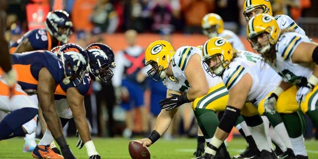 Green Bay Packers center Corey Linsley lines up to hike the football across from the Denver Broncos in the first quarter at Sports Authority Field at Mile High in Denver on Sunday, Nov. 1, 2015.
