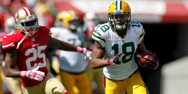 Green Bay Packers wide receiver Randall Cobb runs with the ball after making a catch against the San Francisco 49ers in the first quarter at Levi's Stadium in Santa Clara, Calif., on Sunday, Oct. 4, 2015.