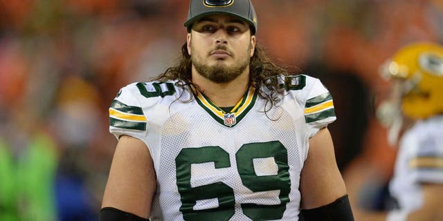 Nov 1, 2015; Denver, CO, USA; Green Bay Packers tackle David Bakhtiari (69) walks the sidelines late in the fourth quarter against the Denver Broncos at Sports Authority Field at Mile High. The Broncos defeated the Packer 29-10.