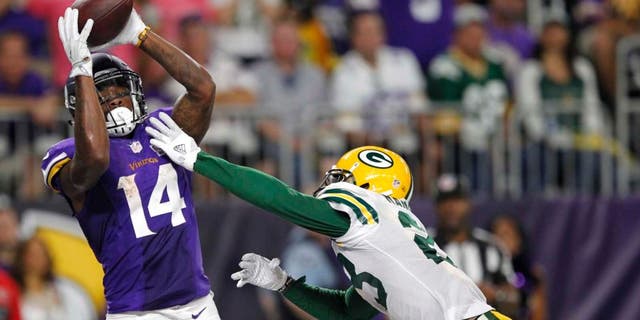 Minnesota Vikings wide receiver Stefon Diggs catches a 25-yard touchdown pass over Green Bay Packers cornerback Damarious Randall during the second half Sunday, Sept. 18, 2016, in Minneapolis.
