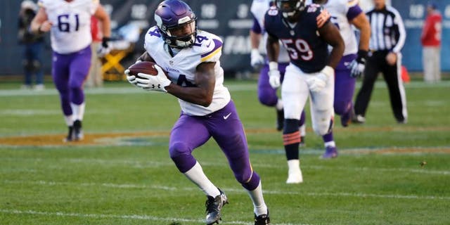 Minnesota Vikings wide receiver Stefon Diggs runs to the end zone for a touchdown during the second half of an NFL football game against the Chicago Bears on Sunday, Nov. 1, 2015, in Chicago.