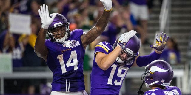 Minnesota Vikings wide receiver Stefon Diggs celebrates his touchdown with wide receiver Adam Thielen during the third quarter against the Green Bay Packers.