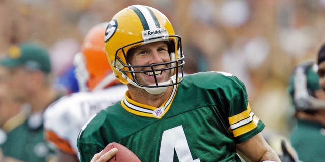 <p>Brett Favre laughs after rushing for a first down against the Cleveland Browns on Sept. 19, 2005, in Green Bay, Wis.</p>