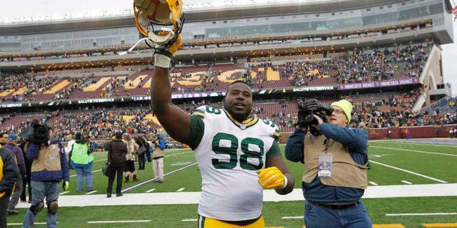 Green Bay Packers nose tackle Letroy Guion celebrates after the Packers' 24-21 win against the Minnesota Vikings in Minneapolis.