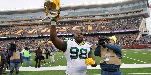 Green Bay Packers nose tackle Letroy Guion celebrates after the Packers' 24-21 win against the Minnesota Vikings in Minneapolis.